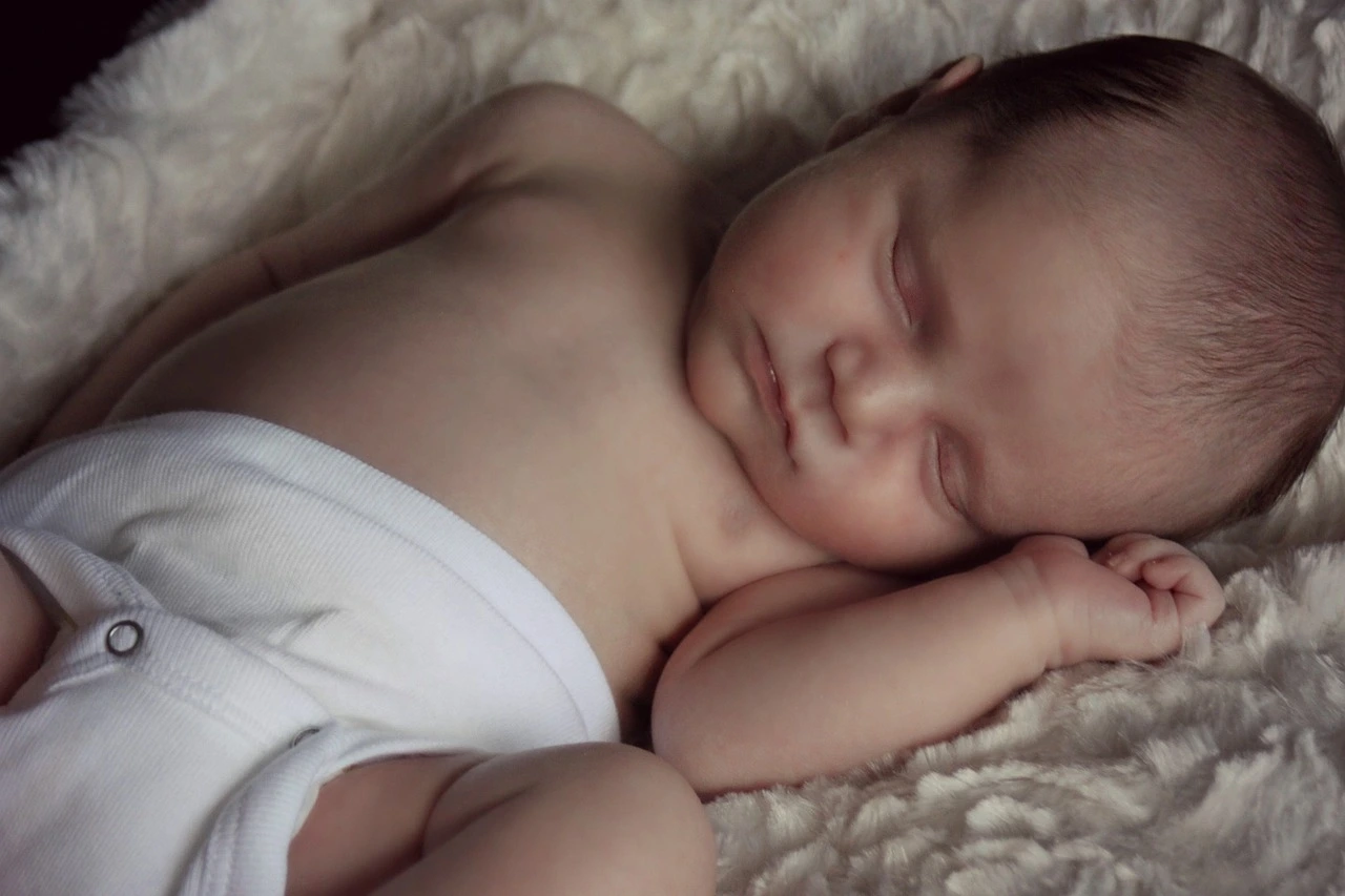 A newborn sleeping peacefully overnight